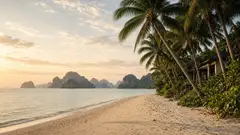 Quiet Krabi beach with coastal accommodation and limestone islands