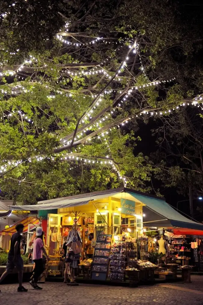 Chiang Mai night market beneath illuminated trees